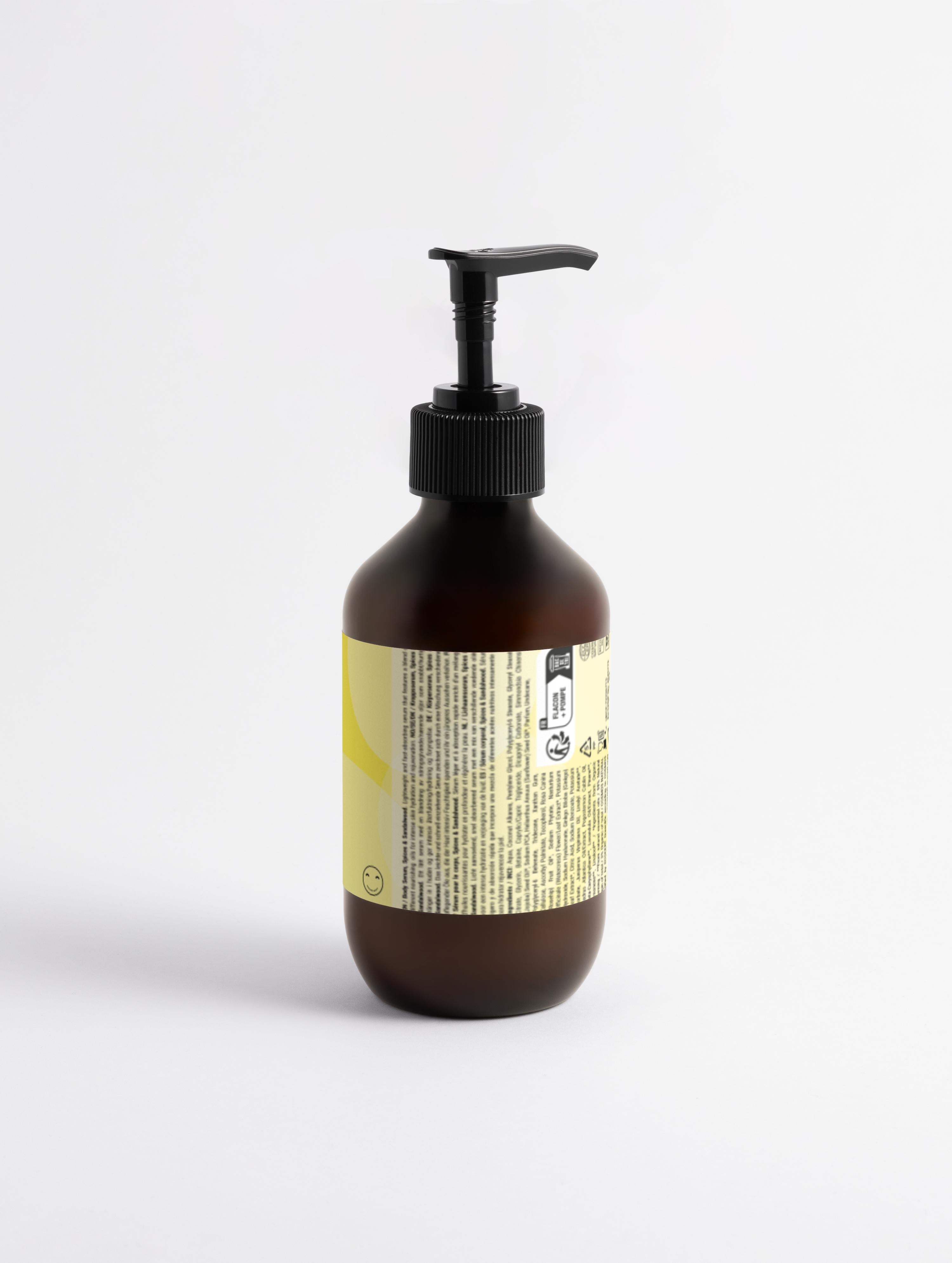 Brown bottle with pump and label on a white background