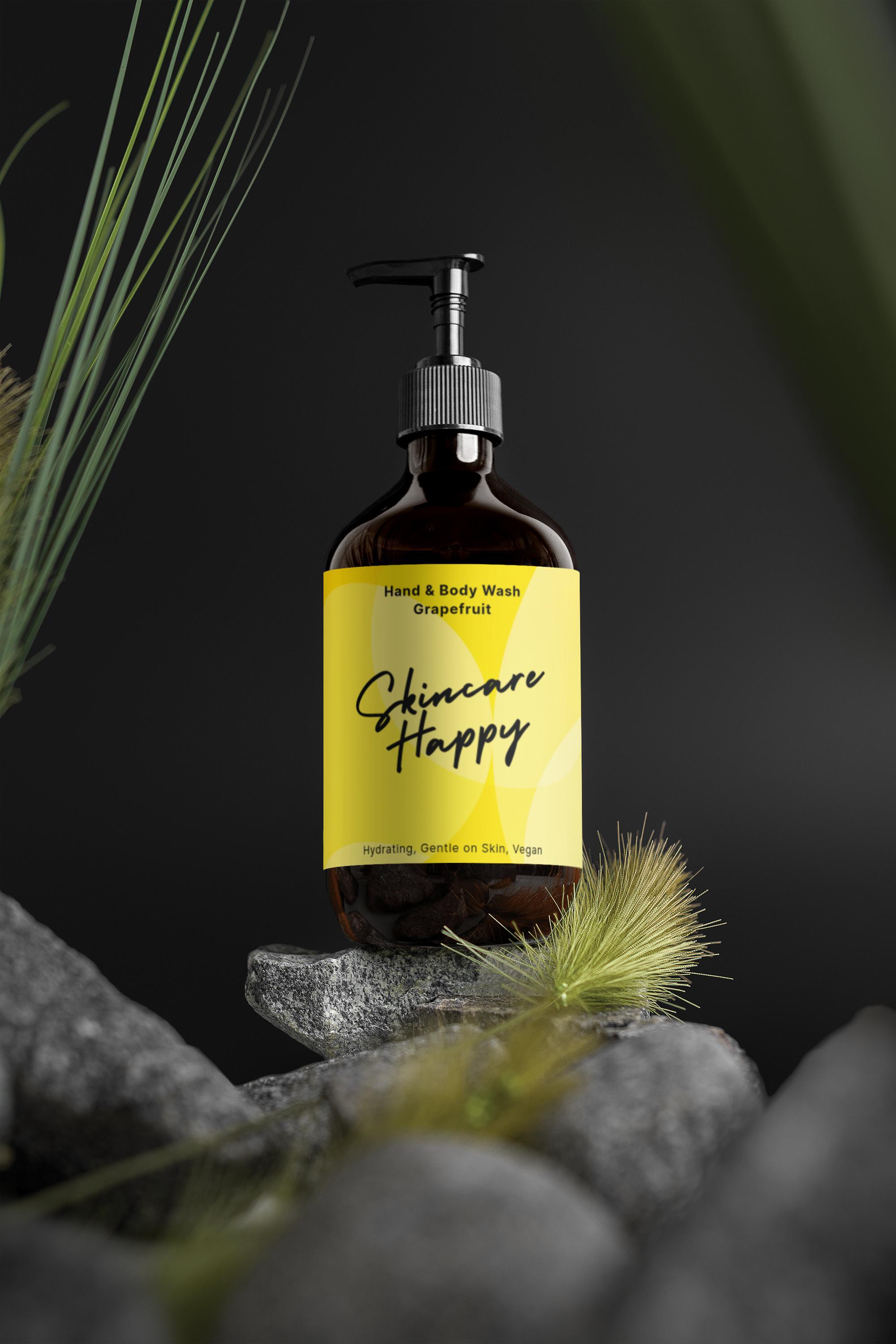 Bottle of 'Skincare Happy' hand and body wash on a rock with grasses in the background