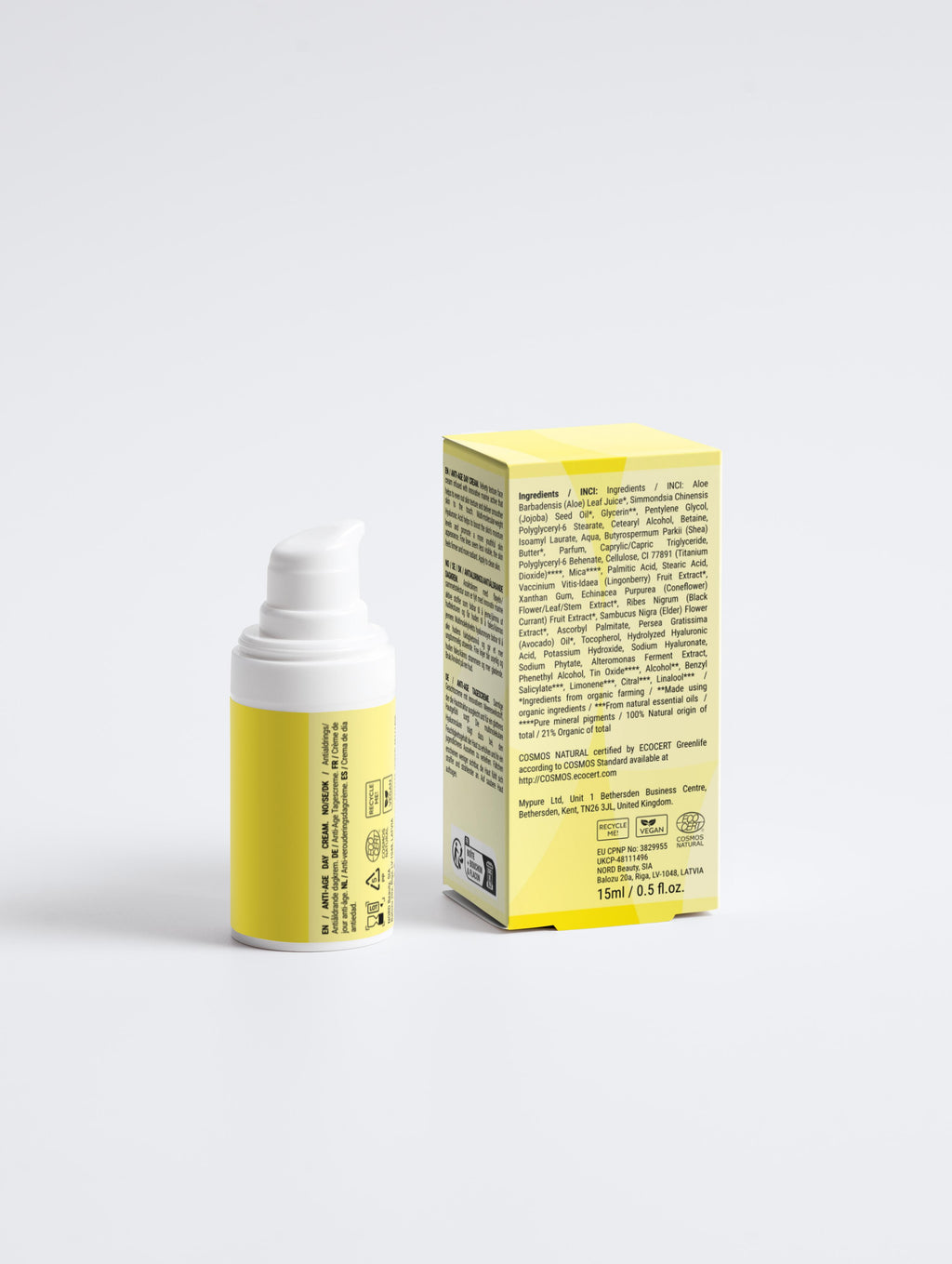 Yellow skincare product bottle and box on a light gray background